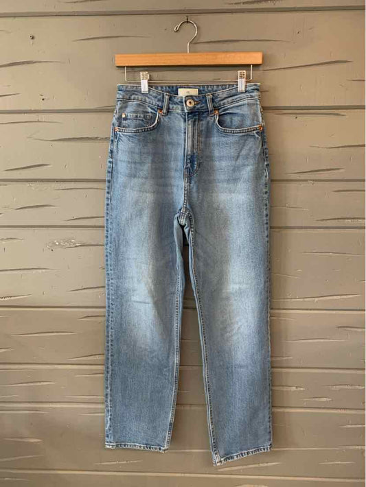 Light blue high-waist straight-leg denim jeans with front pockets and button closure.