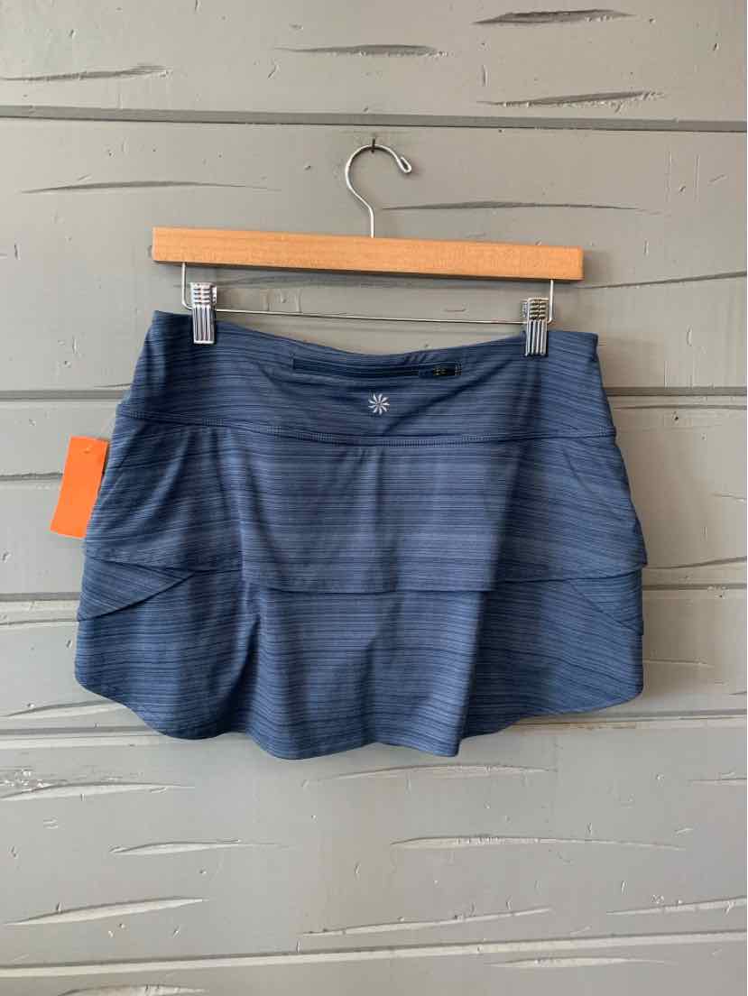 Navy blue athletic skirt with subtle horizontal stripe texture and fitted waistband, size medium.