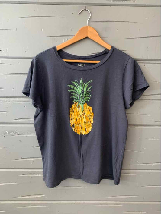 Dark gray short-sleeve t-shirt with round neckline and printed yellow pineapple design centered on front.