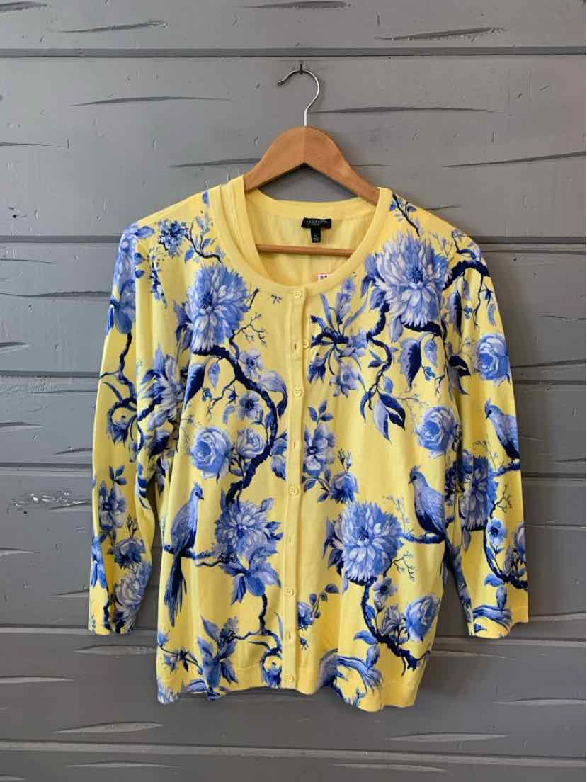 Yellow cardigan with blue floral print, round neckline, button-front, and long sleeves.