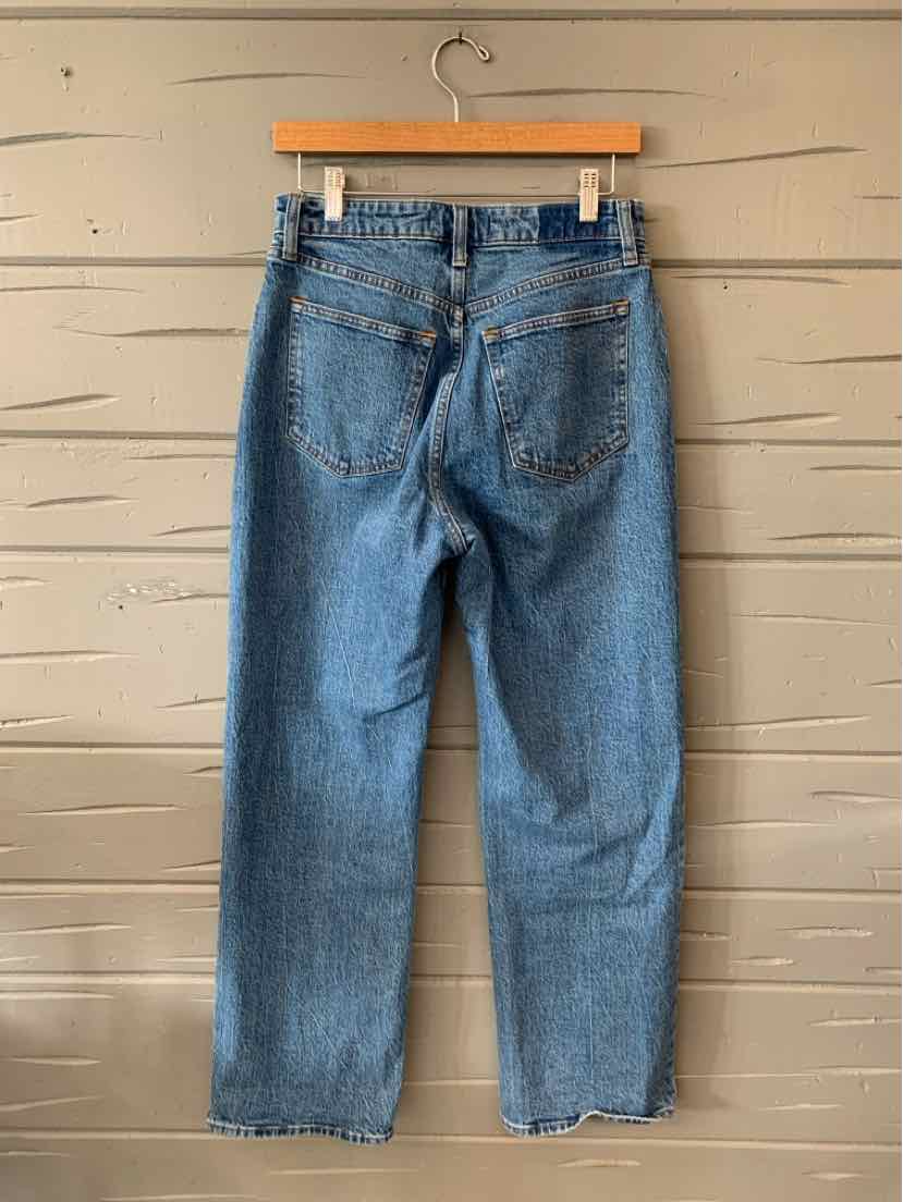 Light blue high-waist straight-leg denim jeans with dual back pockets and belt loops.