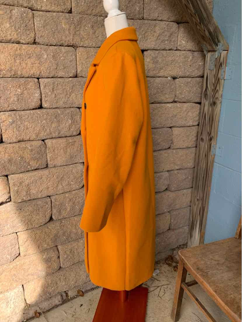 Bright orange longline coat with a notched collar, front buttons, and a single-breasted design.