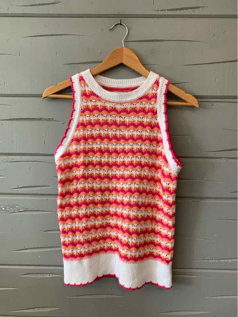 Sleeveless knit top in pink and white with horizontal wave pattern and white ribbed trim at neck, armholes, and hem.
