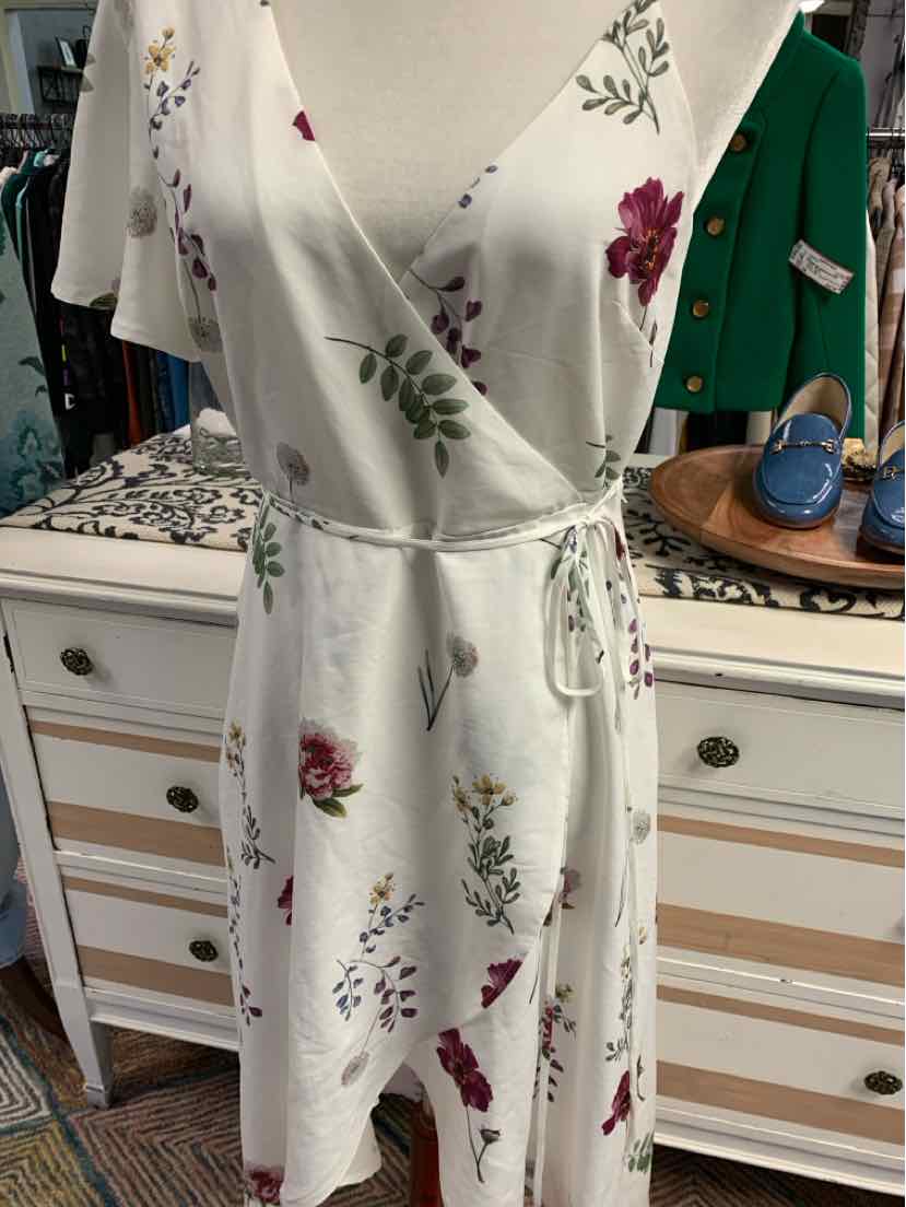 White floral wrap dress with pink and purple flowers, short sleeves, and tie waist in medium size.