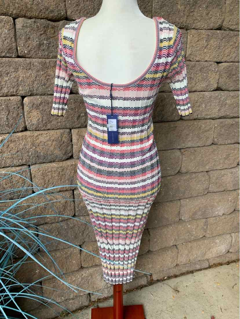Multicolor striped knit bodycon dress with scoop neckline and three-quarter sleeves.