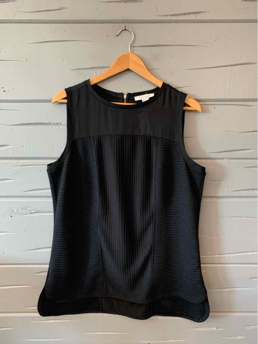 Black sleeveless blouse with sheer upper panel, round neckline, and flowy fit.