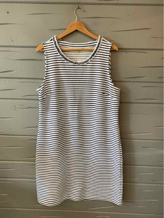White sleeveless dress with navy horizontal stripes, scoop neckline, knee-length, relaxed fit.