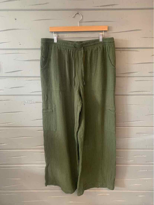 Olive green wide-leg pants with an elastic waistband and side pockets, size 18.