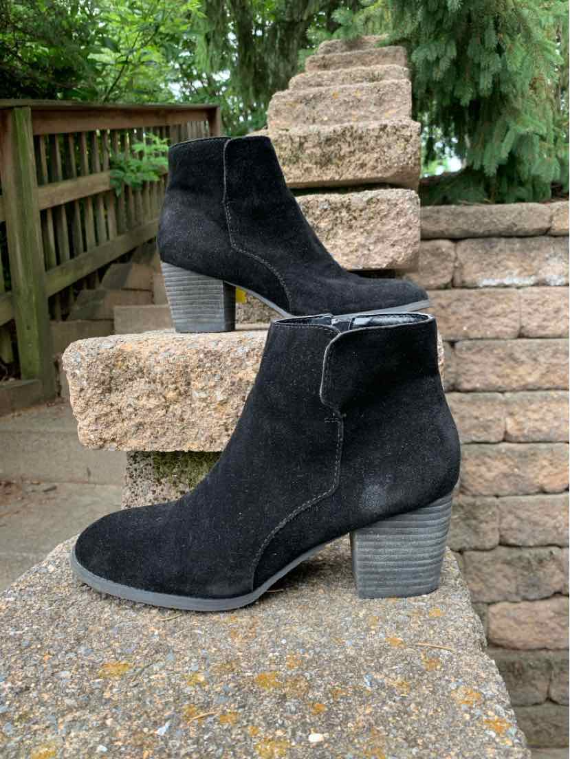 Black suede ankle boots with stacked block heels and side zipper closures.