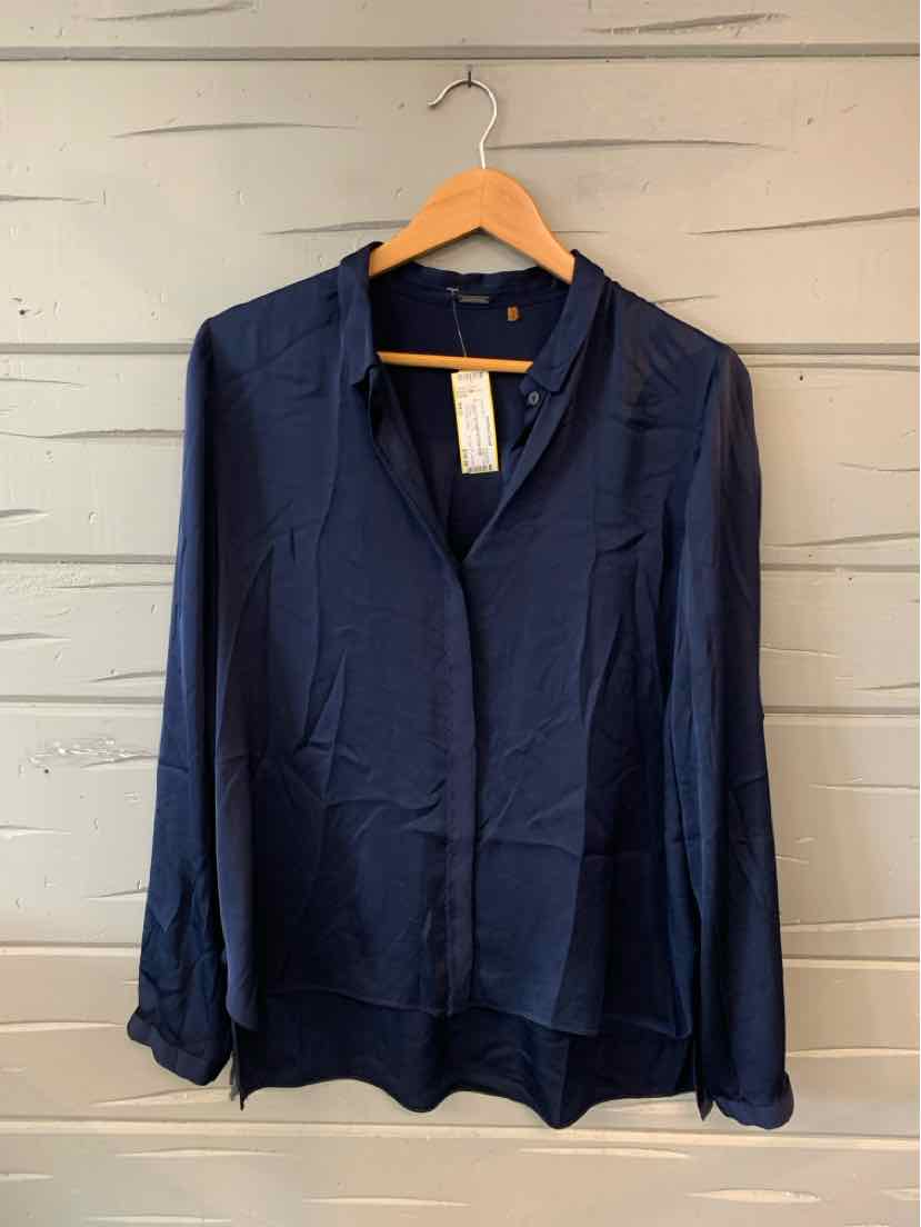 Navy blue long-sleeve blouse with V-neck and relaxed fit on wooden hanger.