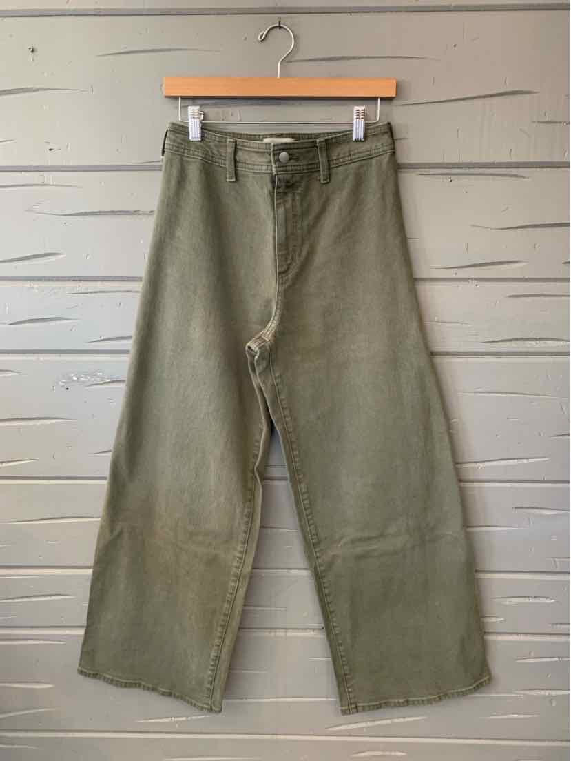 Olive green wide-leg pants with a button closure, belt loops, and subtle front pleats.