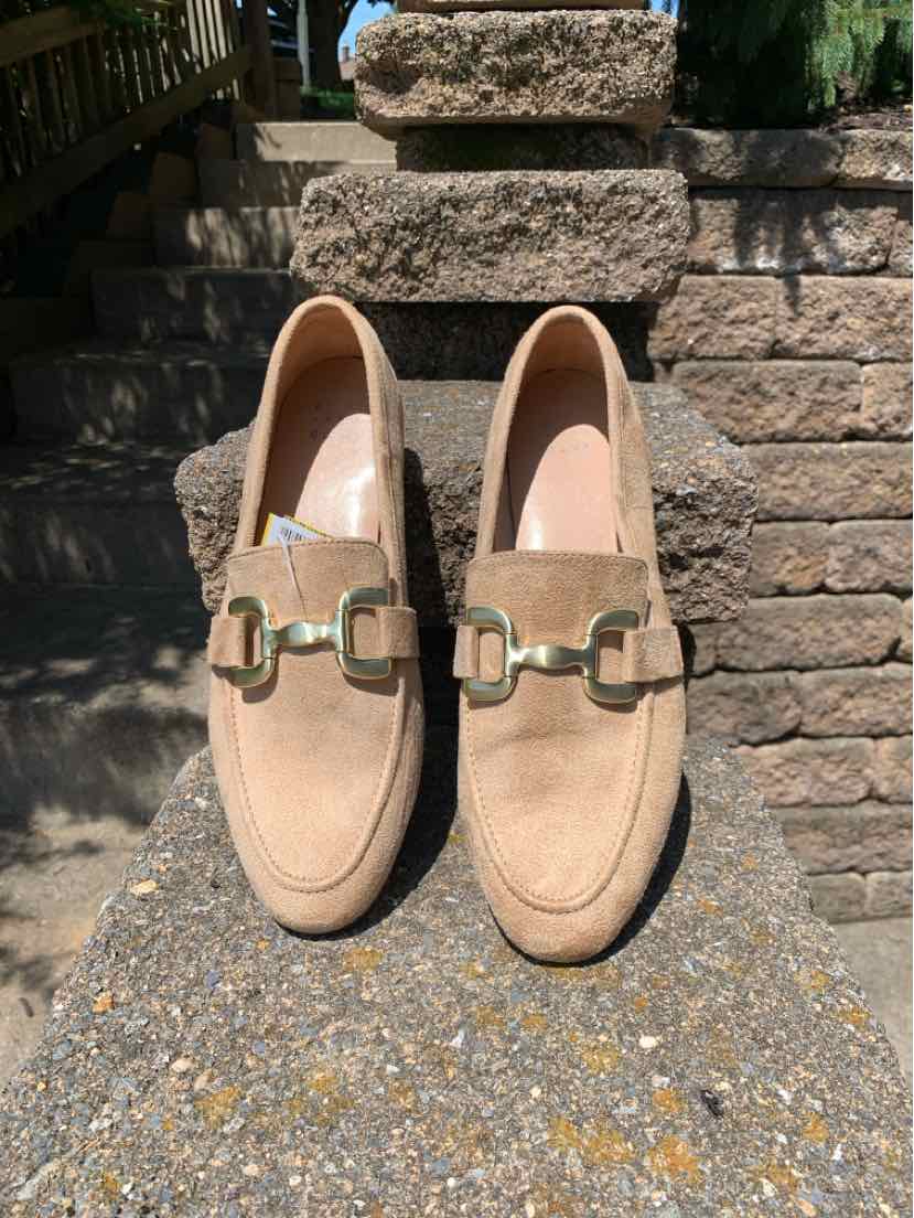 Beige suede loafers with gold-tone metal buckle detail, rounded toe, and low heel, size 9.