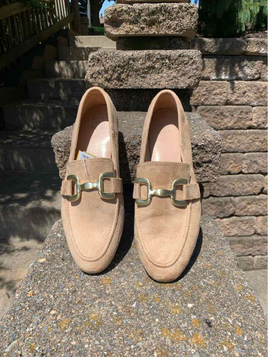 Beige suede loafers with gold-tone metal buckle detail, rounded toe, and low heel, size 9.