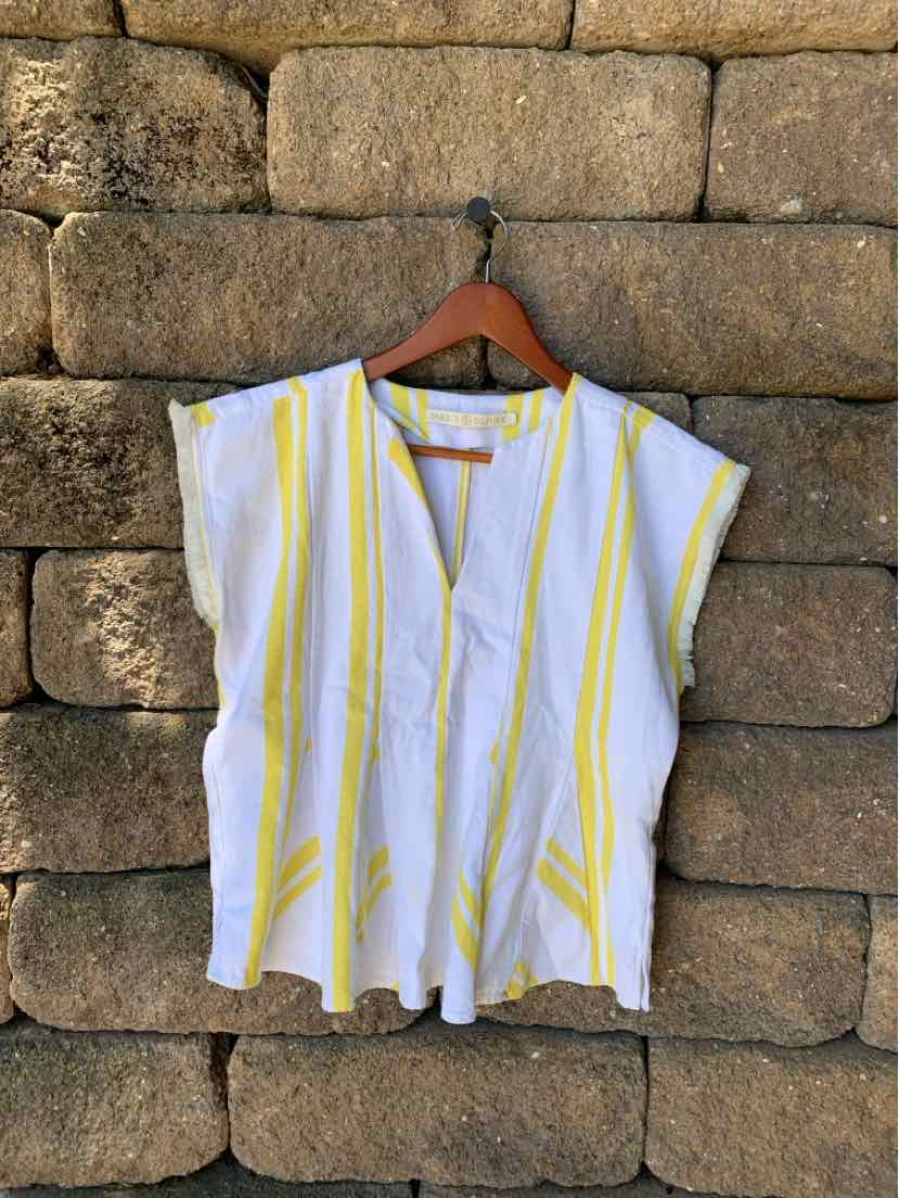 White sleeveless top with yellow vertical stripes, loose fit, V-neckline, lightweight fabric.