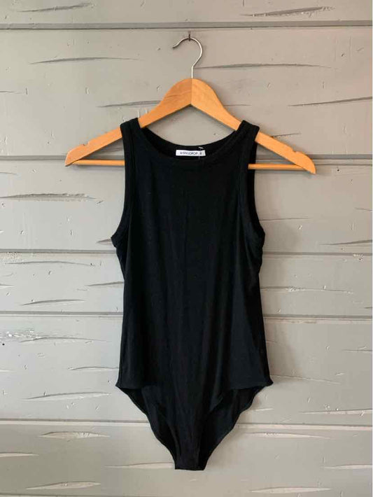 Black sleeveless bodysuit with scoop neckline and smooth fabric hanging on wooden hanger.