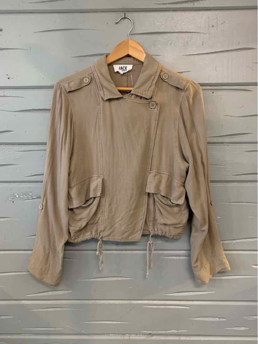 Light brown long-sleeve jacket with dual flap pockets and buckle collar detail on wooden hanger.