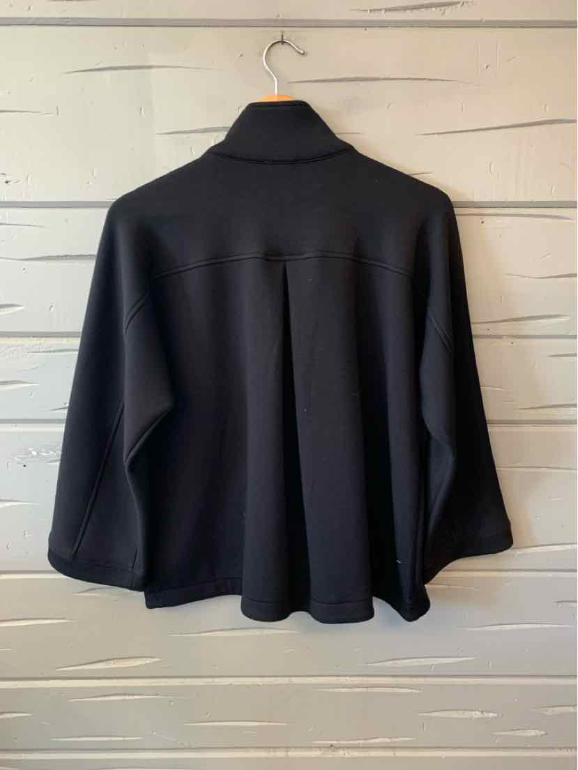 Black Talbots women’s cape-style jacket with a high collar, three-quarter sleeves, and a loose draped silhouette.