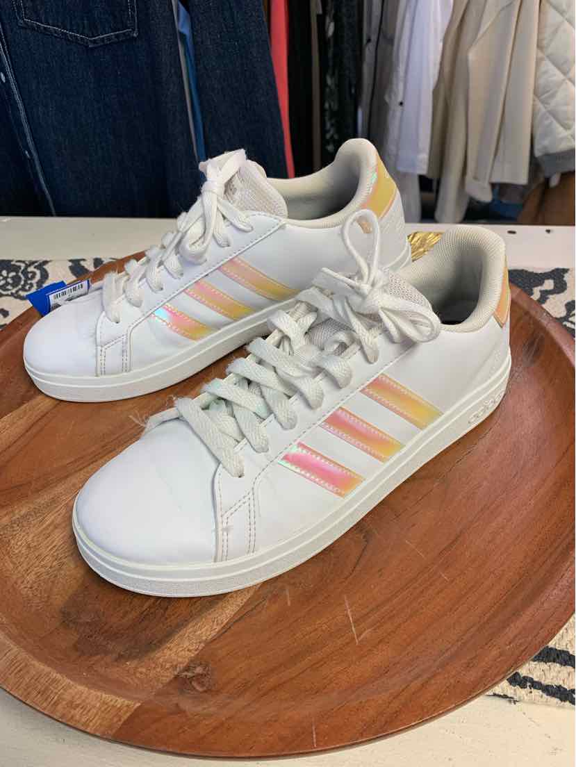 White Adidas sneakers with pastel pink, peach, and yellow stripes, size 6, on wooden surface.