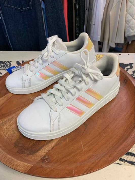 White Adidas sneakers with pastel pink, peach, and yellow stripes, size 6, on wooden surface.