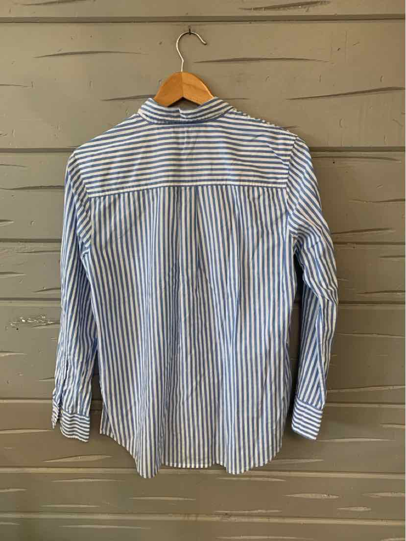 Blue and white striped long-sleeve shirt with yoke back and button cuffs on wooden hanger.