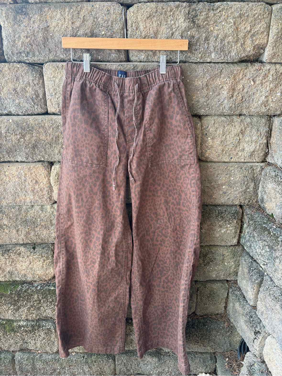 Brown GAP wide-leg trousers with an allover cheetah print and elastic drawstring waist.