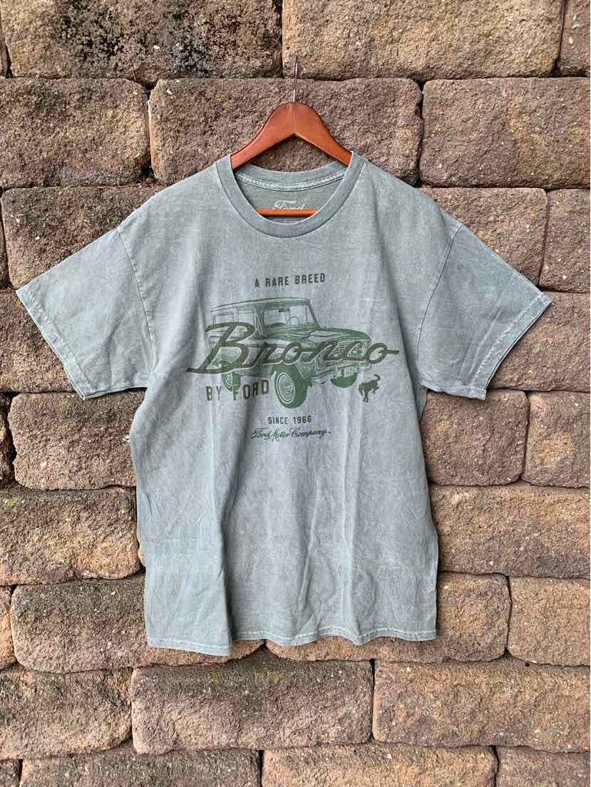 Light gray short-sleeve cotton t-shirt with green "Bronco" graphic and text on front, size large.