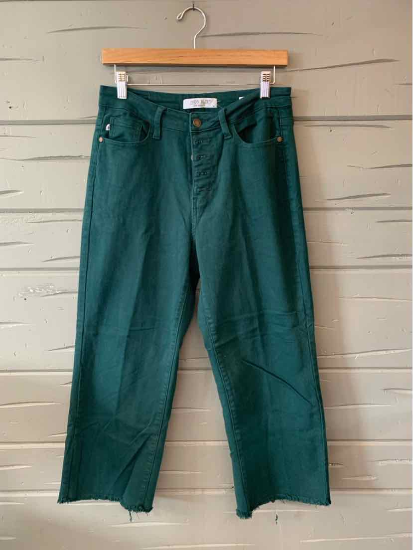 Teal high-waisted straight-leg jeans with raw hem and front button closure.