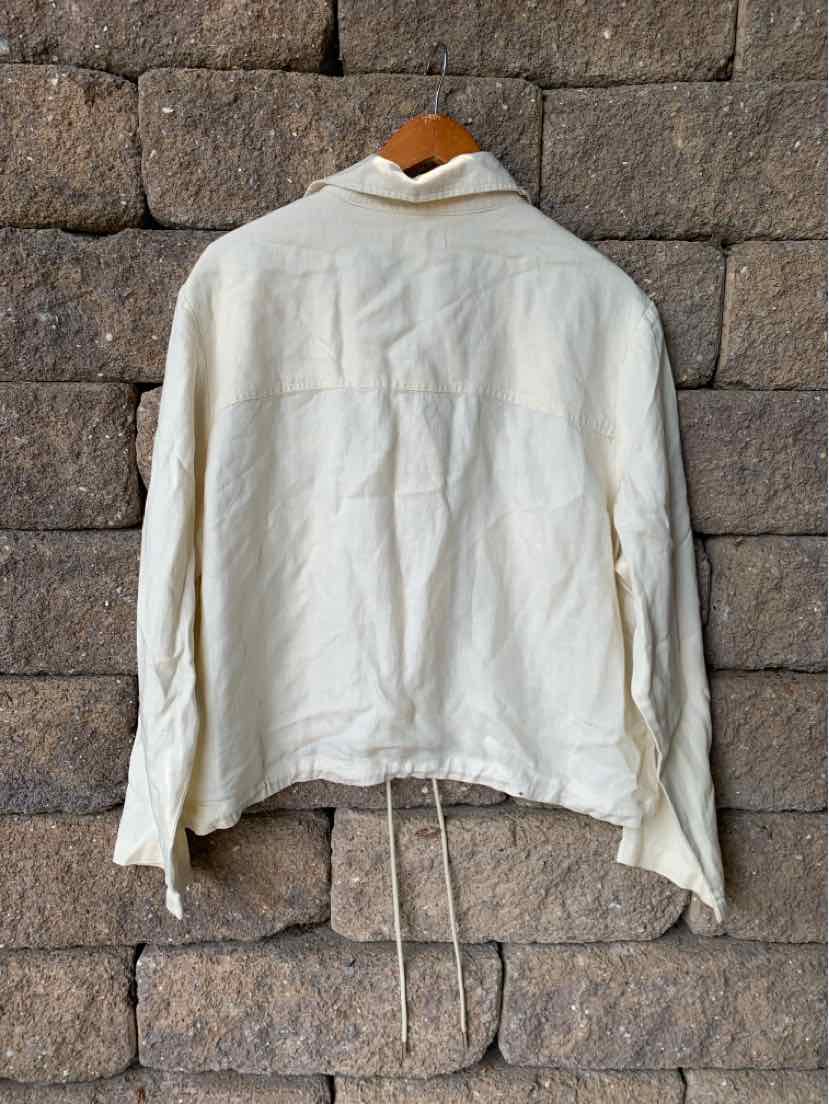 Off-white long-sleeve jacket with collar and adjustable drawstring hem in lightweight fabric.