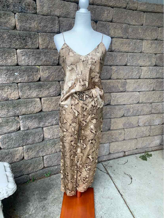 Beige snakeskin print satin spaghetti strap top and matching midi skirt set on mannequin.