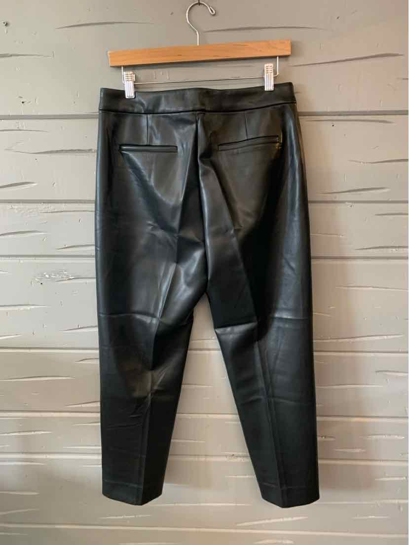 Black faux leather cropped pants with back patch pockets and a slim fit design.