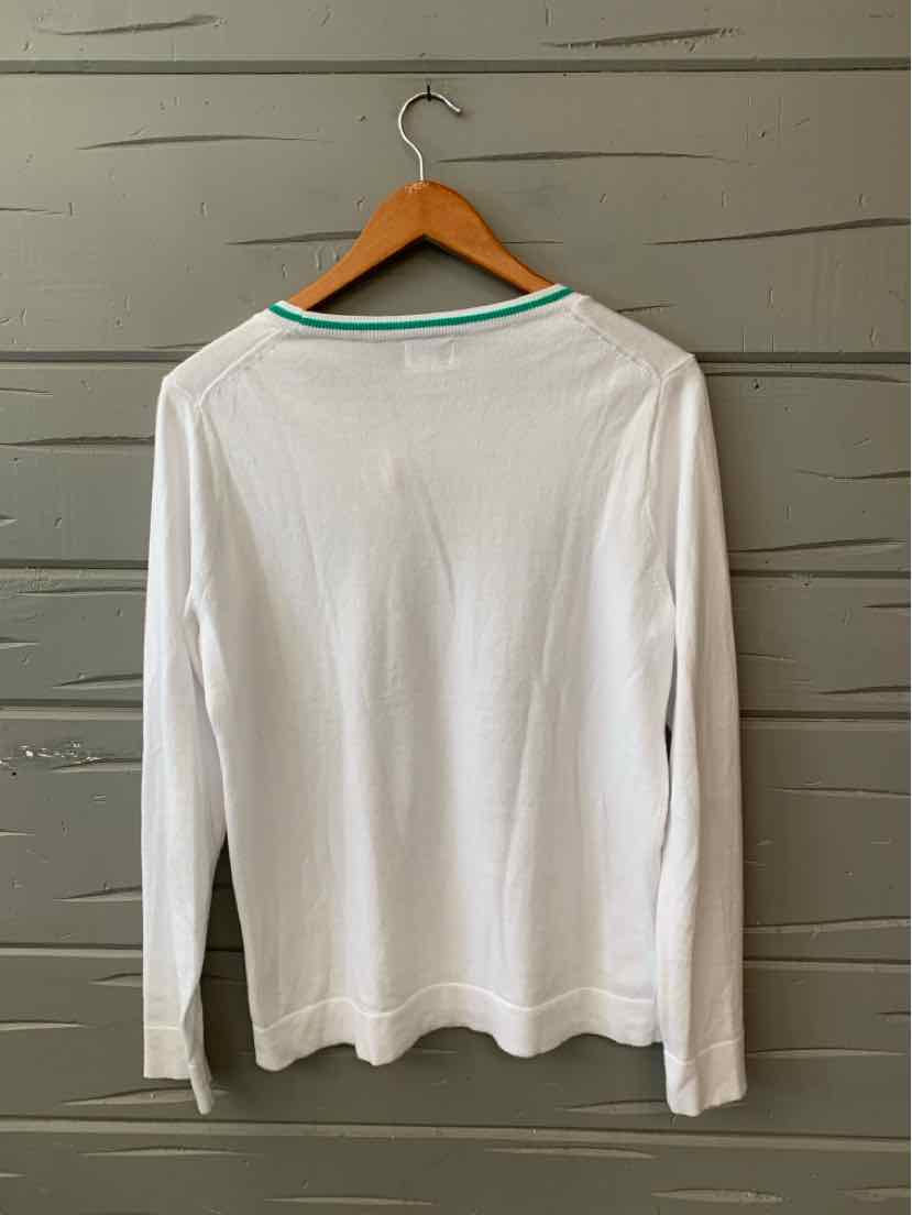 White long-sleeve crew neck shirt with mint green trim on collar, medium size, hanging on wooden hanger.