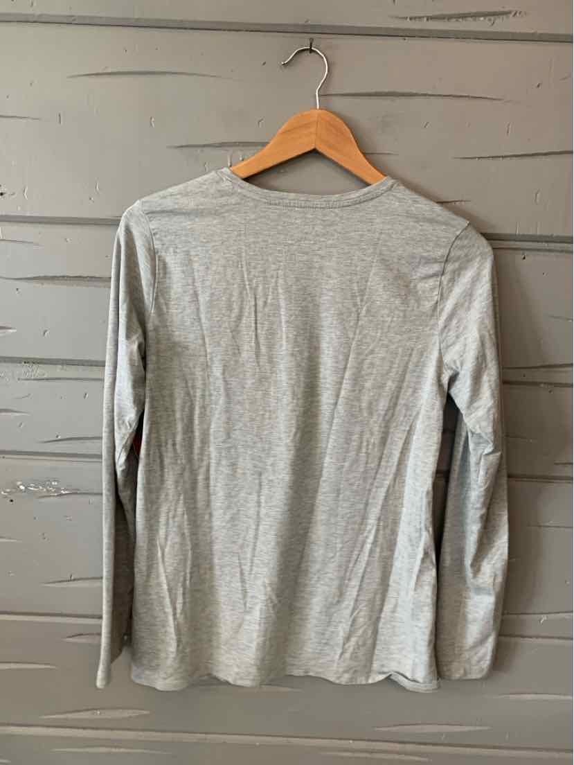 Light gray long-sleeve shirt with a simple, solid design on a wooden hanger.