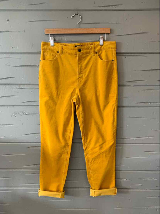 Mustard yellow straight-leg pants with rolled cuffs and front pockets, size 10P.