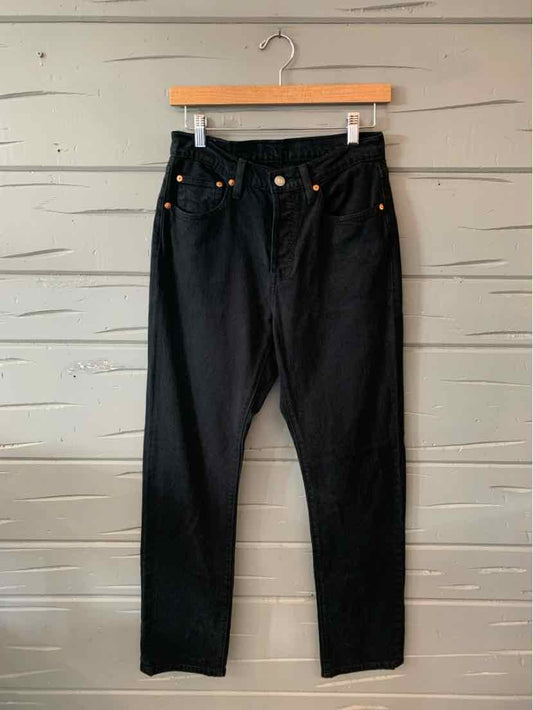Black high-waisted straight-leg denim jeans with front pockets and copper rivet detailing.