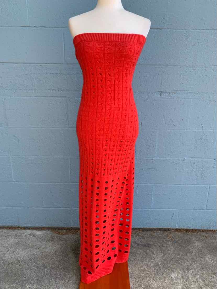 Red crochet strapless midi dress with open weave pattern.