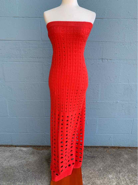 Red crochet strapless midi dress with open weave pattern.
