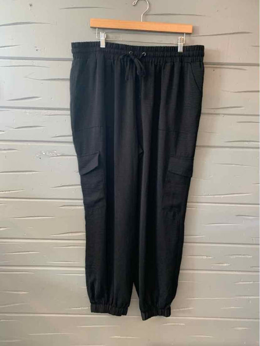 Black cargo jogger pants with drawstring waist, elastic cuffs, and side pockets in size XXL.