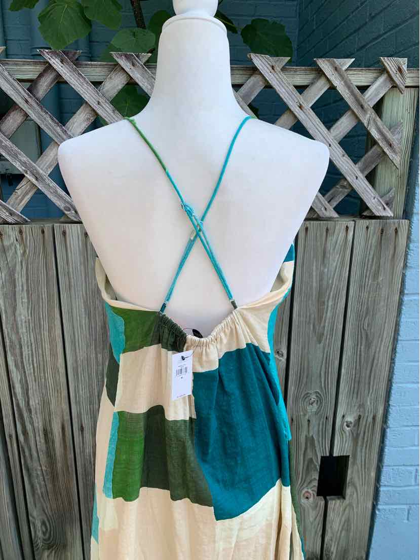 Sleeveless dress with thin crisscross straps, color-blocked in cream, green, blue, and beige cotton fabric.