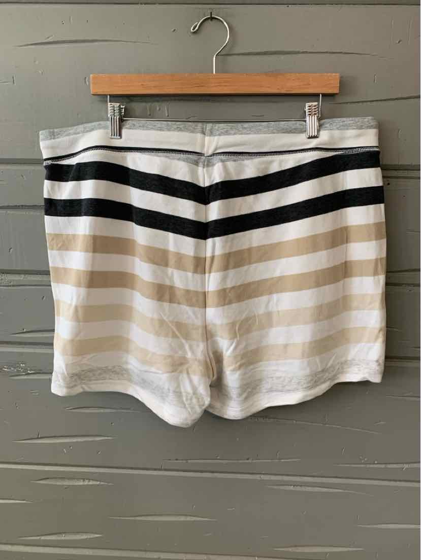 Gray and white striped casual shorts with horizontal black and beige stripes, size XL, hanging on wooden hanger.