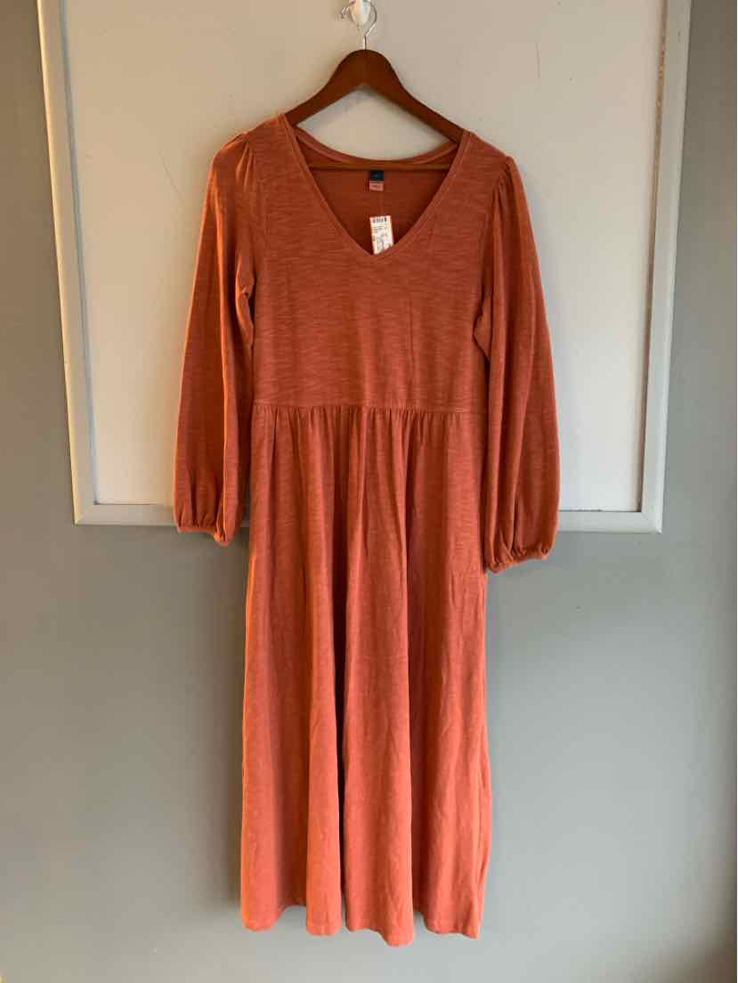 Rust-orange long-sleeve midi dress with V-neck and gathered waist, soft knit fabric.