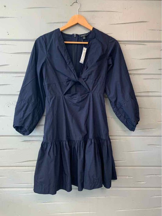 Navy blue Banana Republic dress with a V-neck, long sleeves, gathered waist, and ruffled hem.