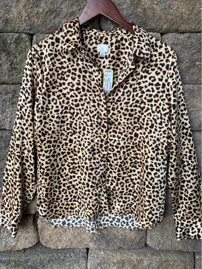 Women's medium two-piece set with long-sleeve cheetah print button-up top in soft fabric.