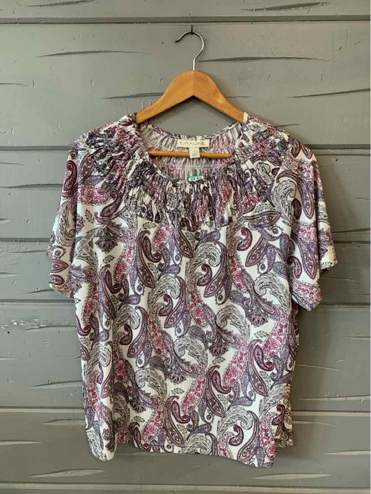 Lightweight blouse in muted purple and grey paisley print with short puff sleeves and gathered neckline.