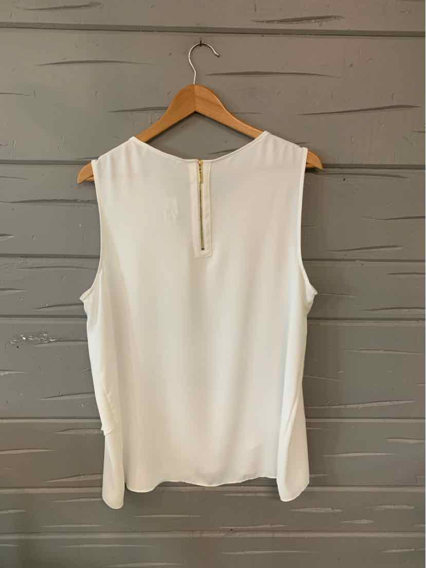 White sleeveless blouse with keyhole back and button closure, size XL, hanging on wooden hanger.