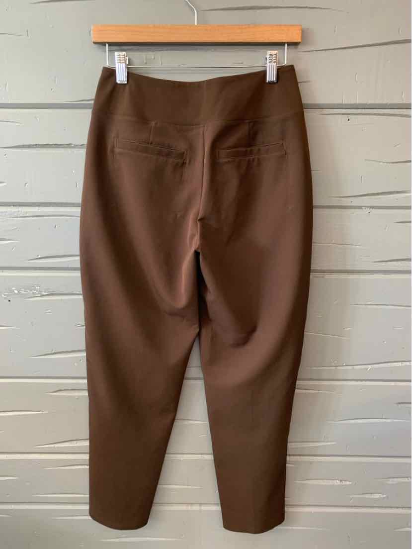 Brown high-waisted slim-fit trousers with back welt pockets, cropped ankle length.