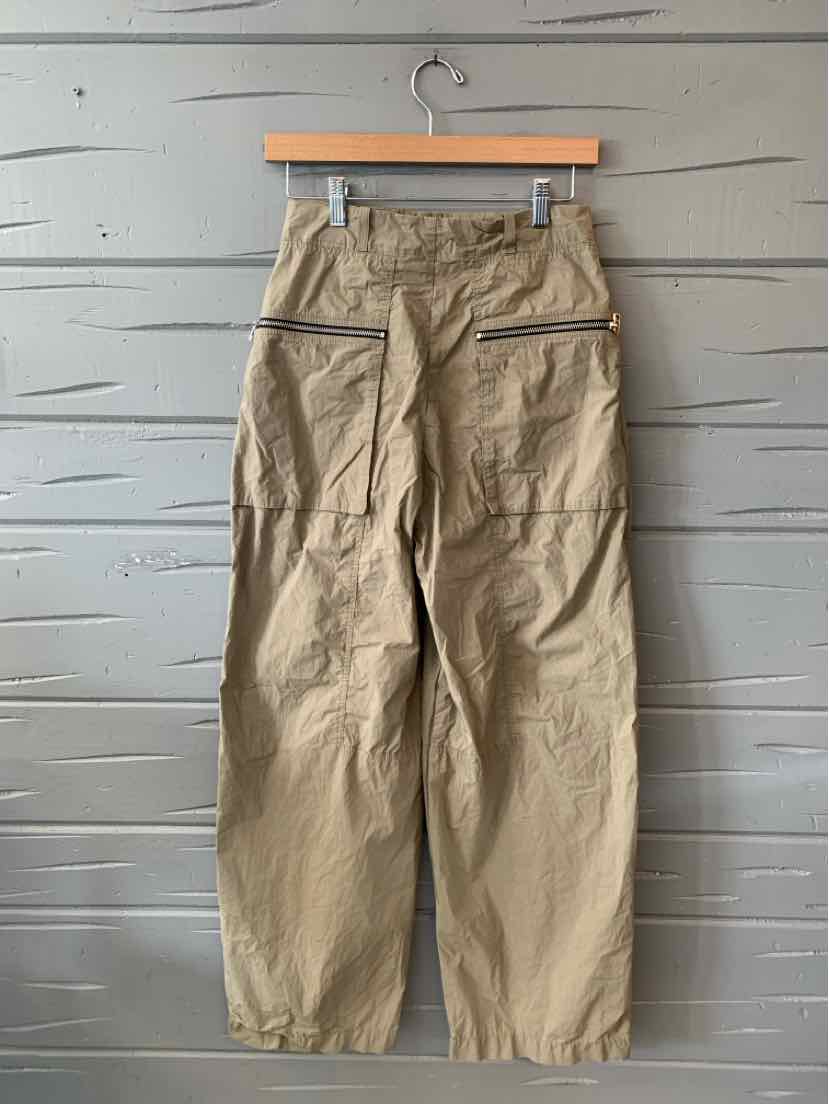 Beige high-waist cargo pants with elastic cuffs and rear zippered pockets.