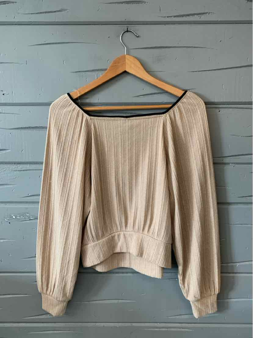 Tan long-sleeve blouse with wide neckline and cinched hem, lightweight textured fabric.