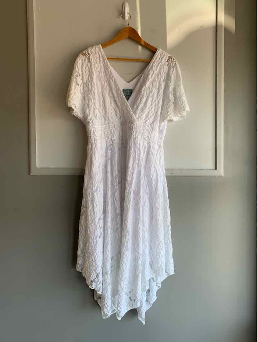 White lace dress with short sleeves and deep V-neck, handkerchief hem, size 14.