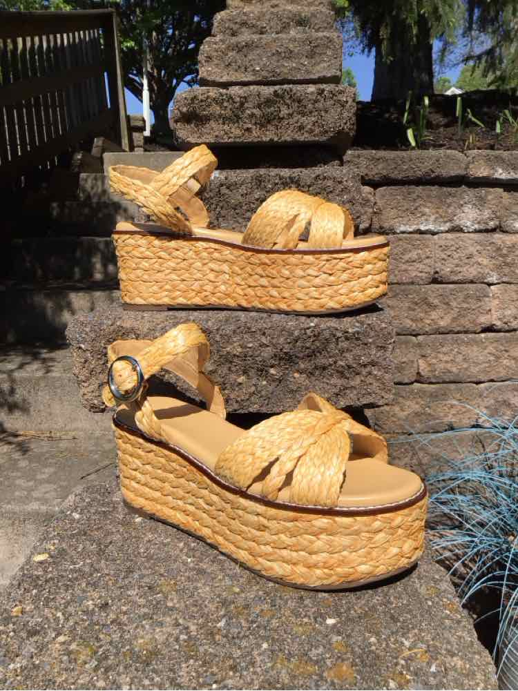 Woven straw platform wedge sandal with ankle strap and buckle in natural tan color, size 9.