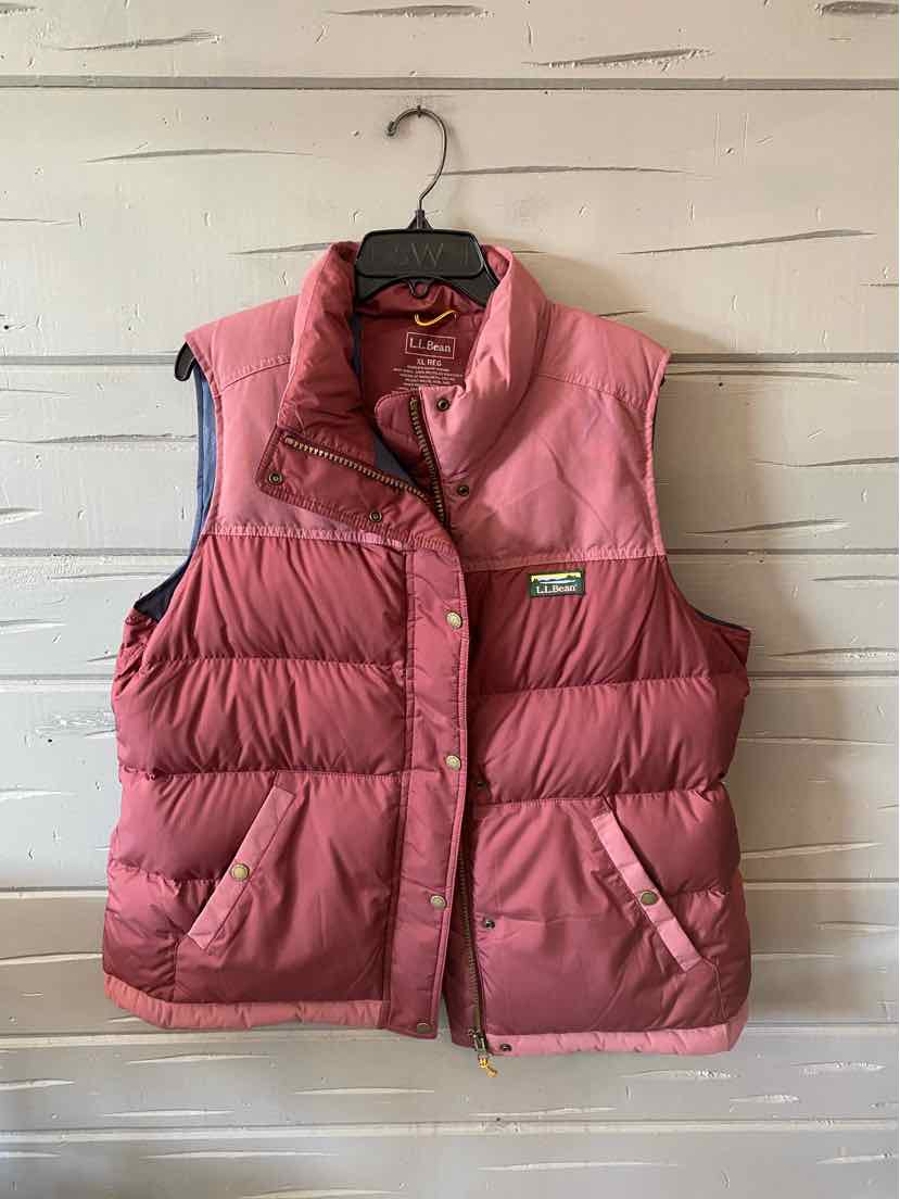 Pink quilted puffer vest with snap buttons and front pockets, size XL, sleeveless design.